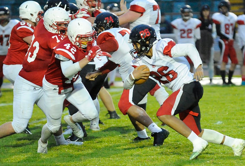 <who>Photo Credit: Lorne White/KelownaNow </who>The Bears' Chayton (42) of Boucherie bears down on Abby's Jalem Catlin.