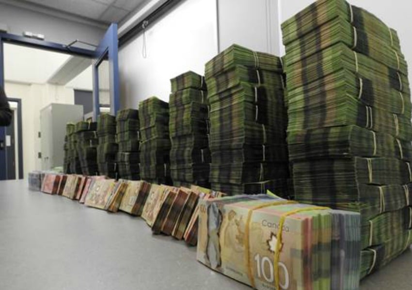 <who> Photo Credit: Edmonton Police </who> $2 million in cash was seized.