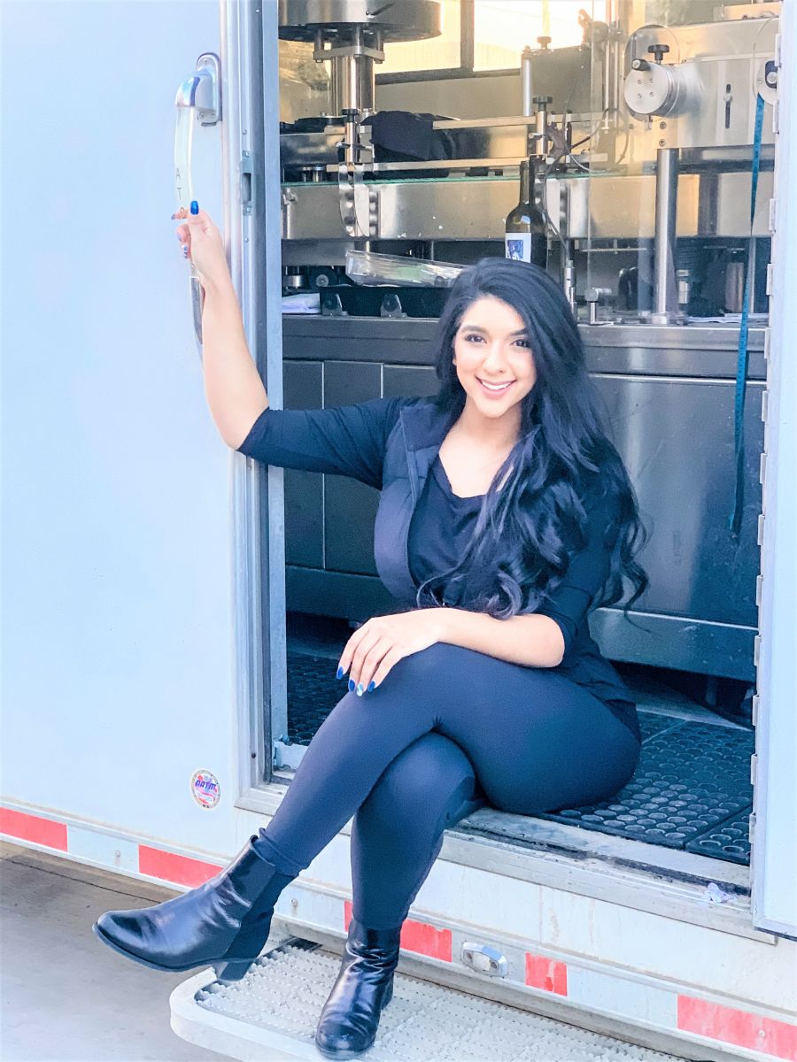 </who>Zarina Randhawa tows her mobile wine bottling line around in a 46-foot-long trailer behind a Dodge 5500 heavy-duty truck.