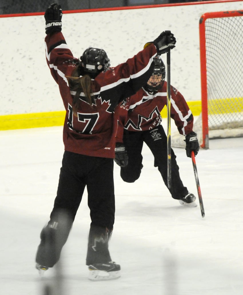 <who>Photo Credit: Lorne White/KelownaNow </who>Jessye Large (foreground) and Kylie Brown celebrate Large's first of two goals in the U16A championship game.