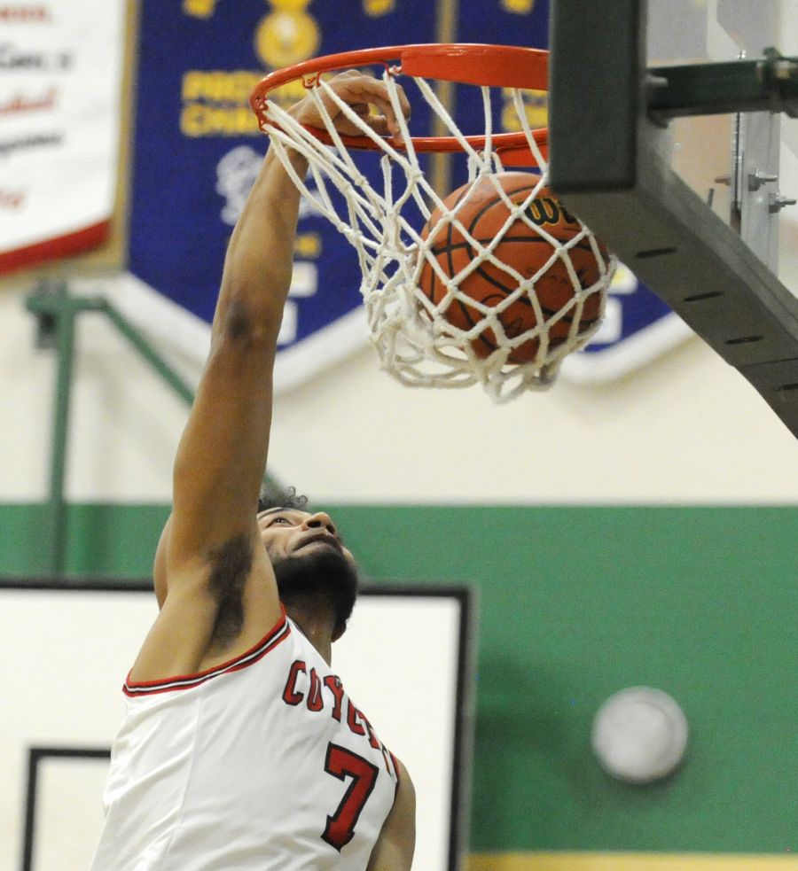 <who>Photo Credit: Lorne White/KelownaNow </who>OC's Derrian Valdes dunks two of his 22 points on Friday against Douglas College.