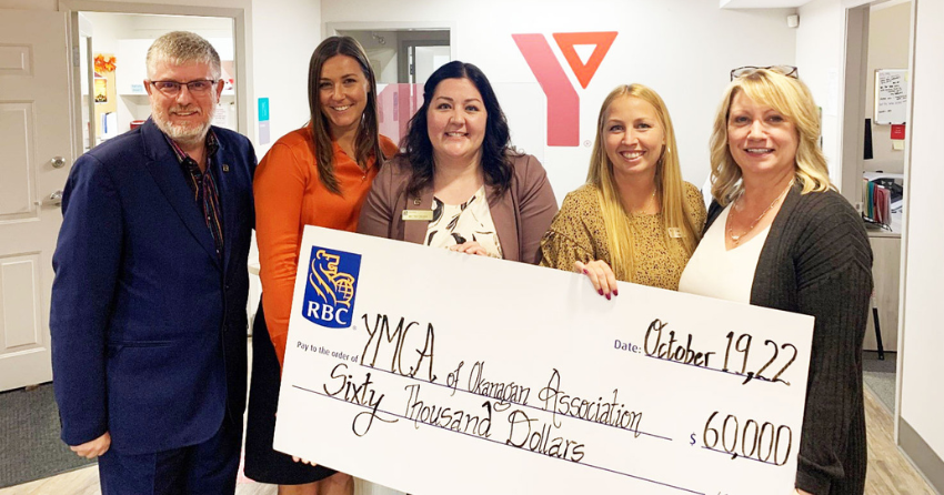 <who> Photo Credit: Contributed </who> Members of the YMCA and RBC pose with the $60,000 check. 