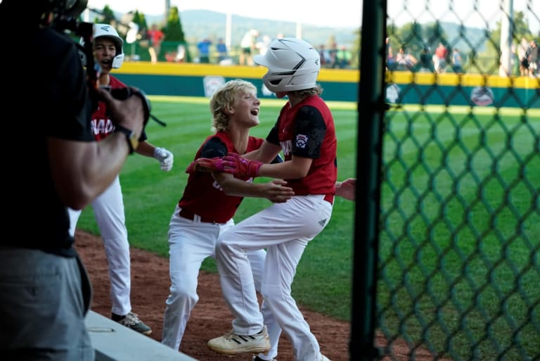 <who>Photo Credit: LLWS</who>Canada celebrates during their 6-run inning against Japan on Friday.