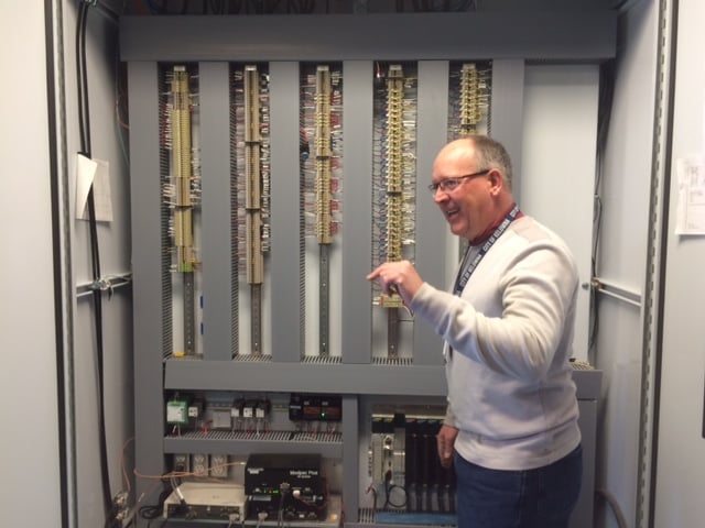 <who> Photo Credit: KelownaNow. </who> Adrian Weaden shows off their complex computer system which controls 124 water facilities. 