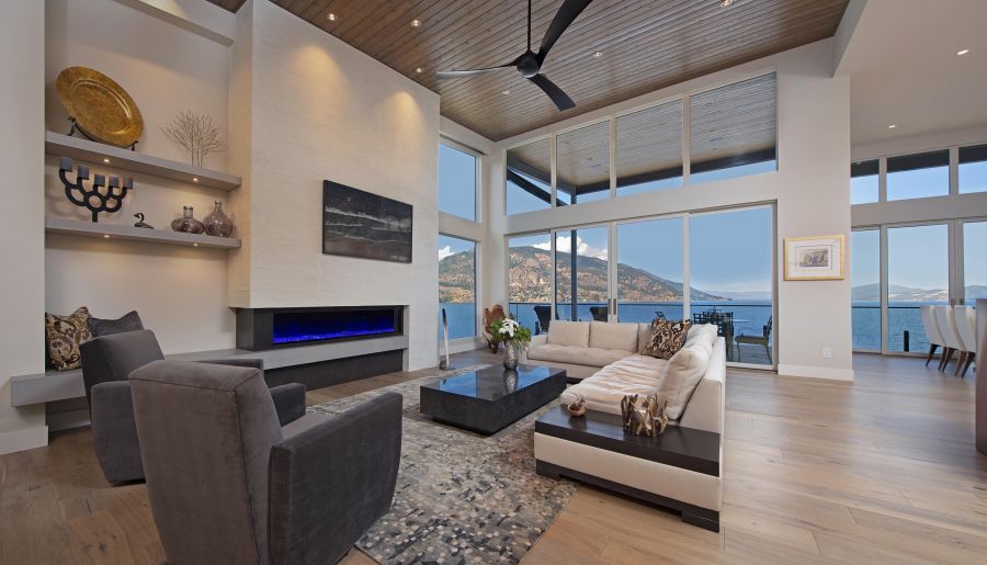 <who>Photo Credit: Colin Jewall Photo Studios</who>High ceilings and expansive windows frame the living room of 'The Overlook'.