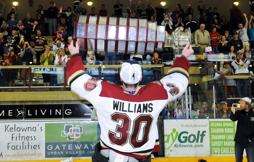 <who>Photo Credit: Lorne White/KelownaNow </who>Winning goaltender Keelan Williams hoists Fred Page Cup for Warriors' fans.