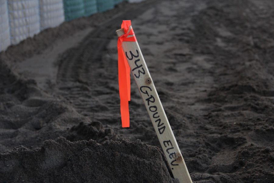 <who> Photo Credit: KelownaNow </who> Water levels exceeding 343 metres could mean more flooding. The marker is from Mushroom beach.