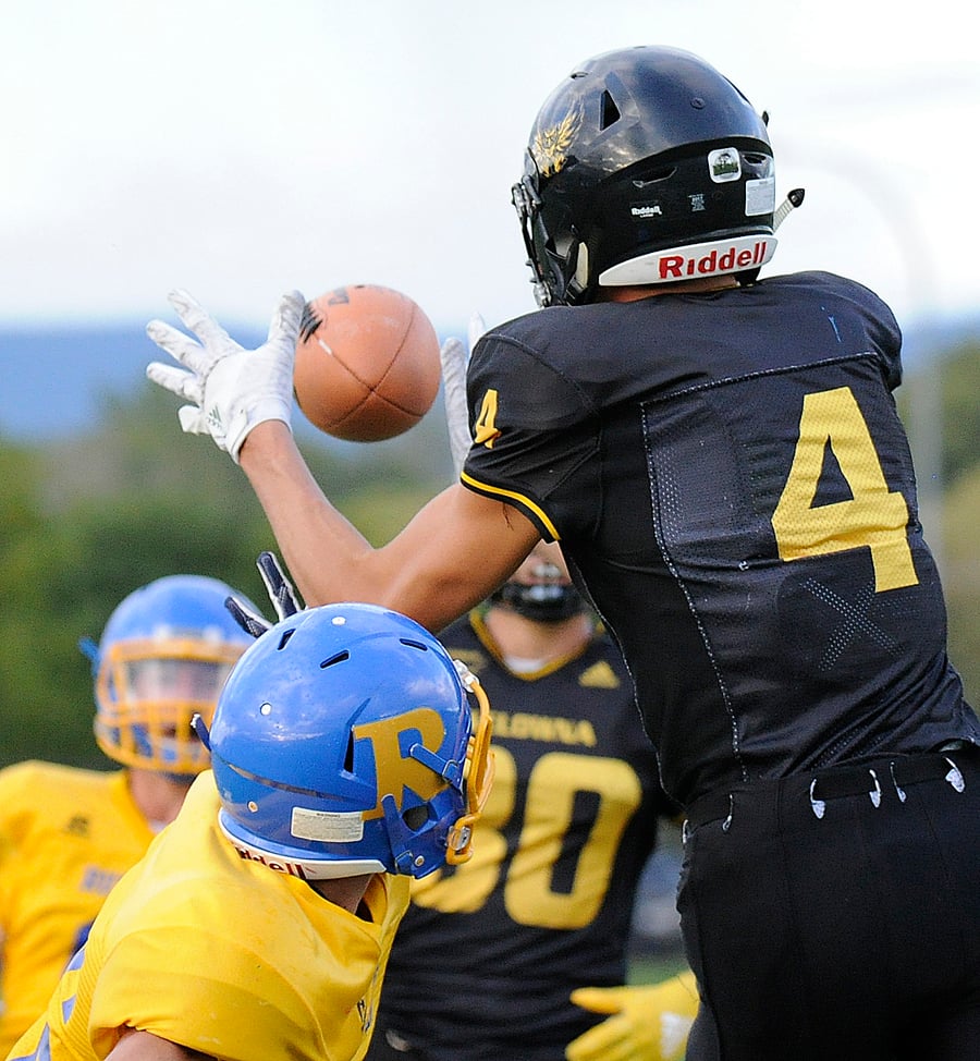 <who>Photo Credit: Lorne White/KelownaNow </who>Another catch by Caeleb Schlachter during the Owls' first drive of the game.