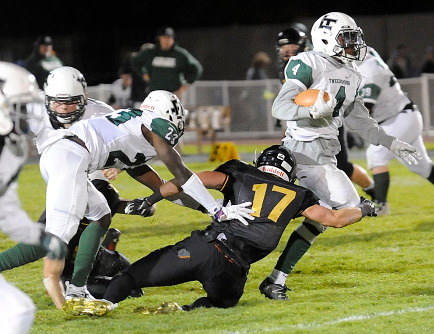 The Owls' Nolan Ulm reaches to grab Lord Tweedsmuir's Yosef Drysdale.