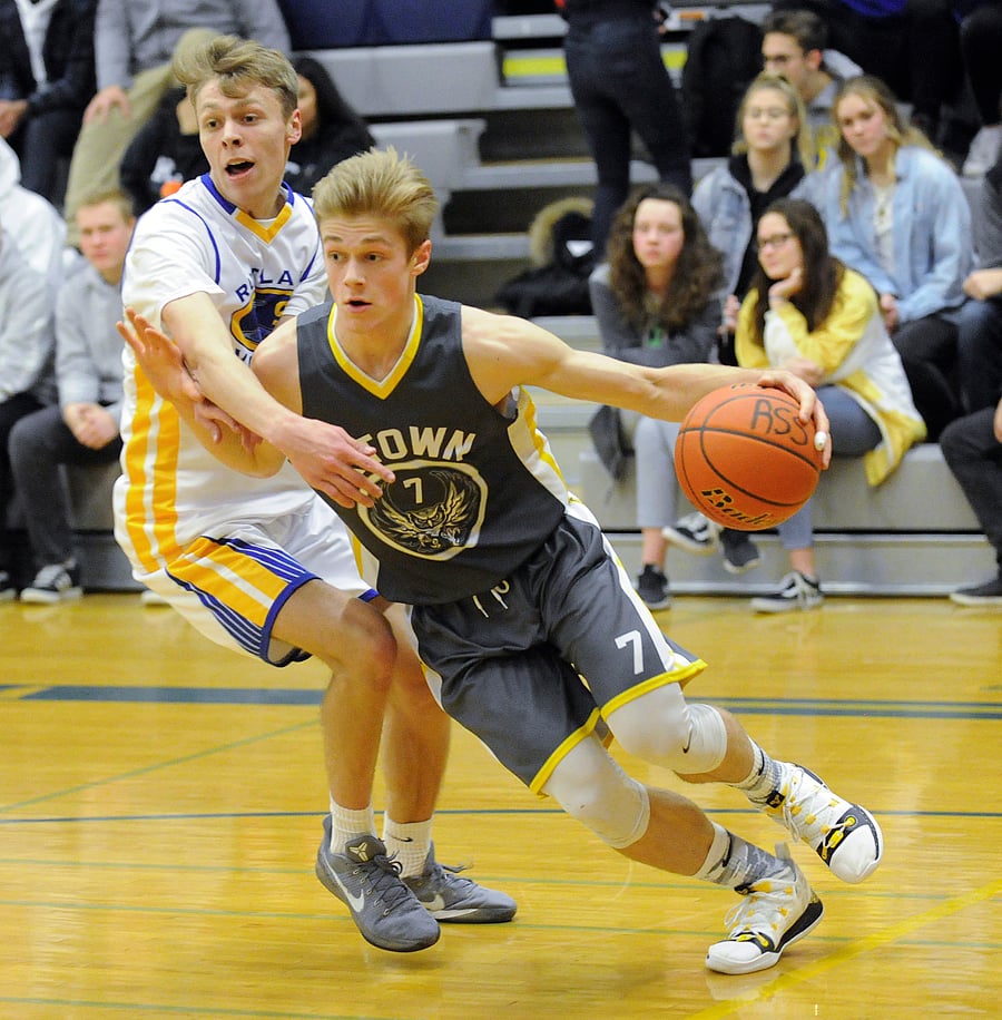 <who>Photo Credit: Lorne White/KelownaNow </who>Parker Johnstone, right, led the Owls with 19 points in a 4A win over Rutland.