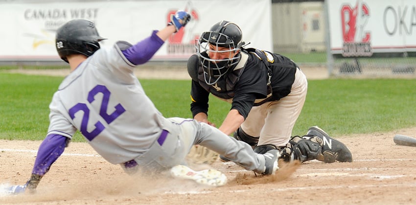 <who>Photo Credit: Lorne White/KelownaNow </who>Marcus Strother of the Okanagan A's puts the tag on the Parksville Royals' Kieran Bowles in the first of the two teams' four games on the weekend at Elks Stadium.