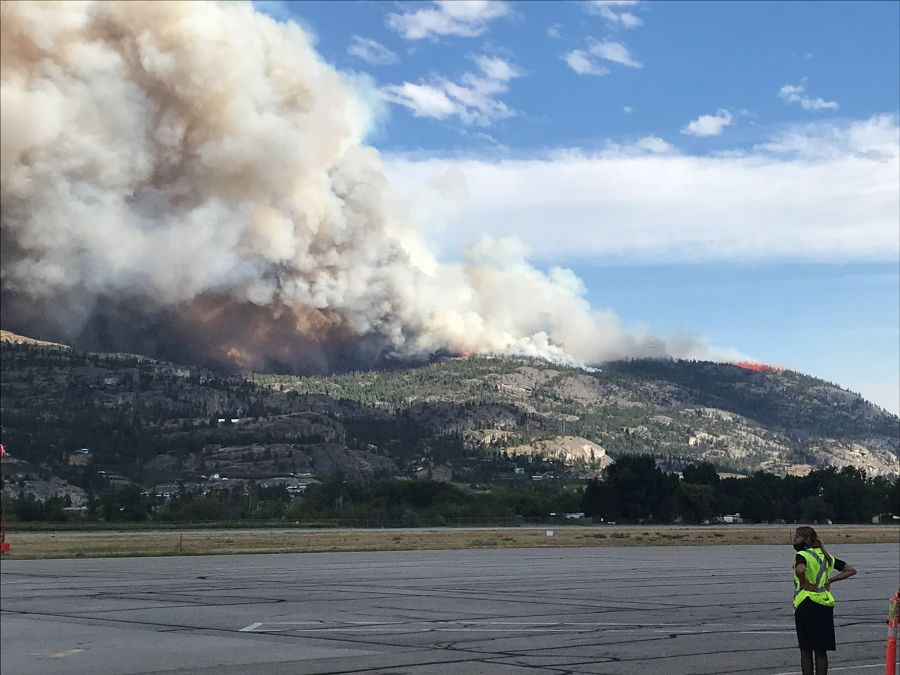 <who>Photo Credit: Trisha White</who> Trisha White got this pic of the rapidly expanding fire while still at the airport