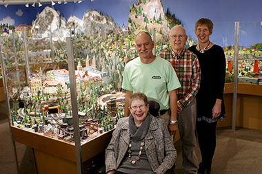 <who>Photo Credit: Osoyoos Desert Model Railroad </who>The accolades and awards continue to pour in for the Osoyoos Desert Model Railroad. The unique tourist attraction was entered into the TripAdvisor Hall of Fame on Monday. Members of the family-run business include Poul Pederson (far right), his wife Ulla, daughter Lotte and her husband Joe Mendes.