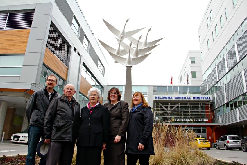 The Person family celebrates the ribbon cutting.