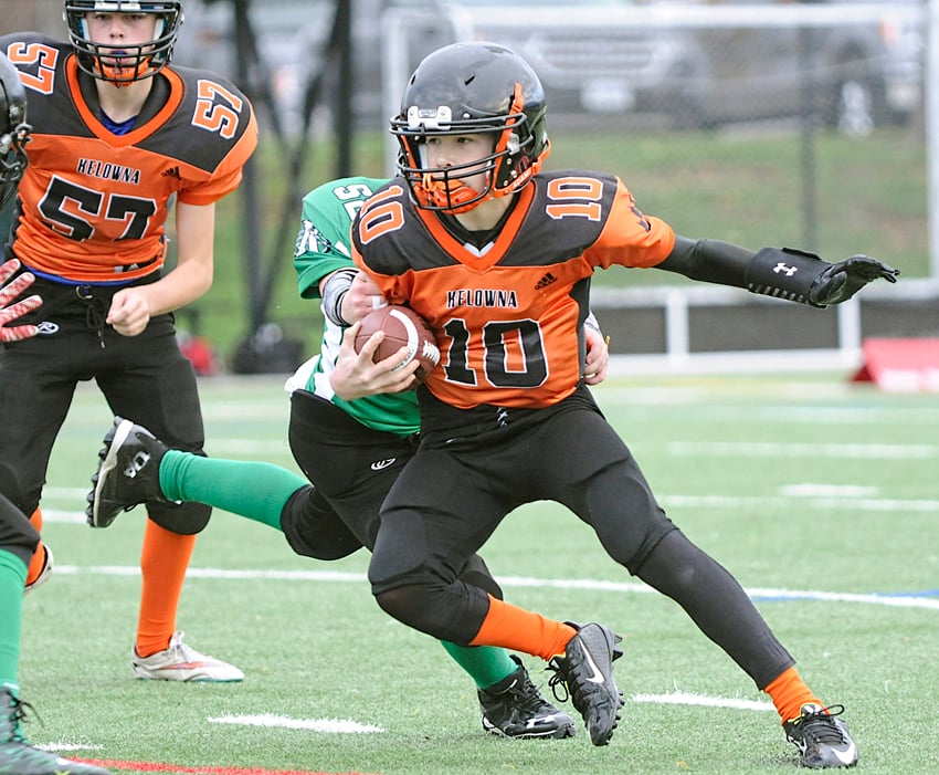 <who>Photo Credit: Lorne White/KelownaNow </who>Kelowna Lions quarterback Nate Beauchemin scored a pair of touchdowns in the SIFC junior championship game against the Salmon Arm Chargers.