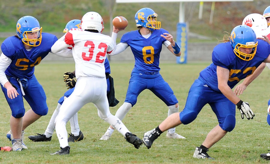 Liam Attwood winds up for one of his 16 pass attempts against the Mt. Boucherie Bears. The Grade 11 QB completed 12 passes for 165 yards and two touchdowns in the shutout win.