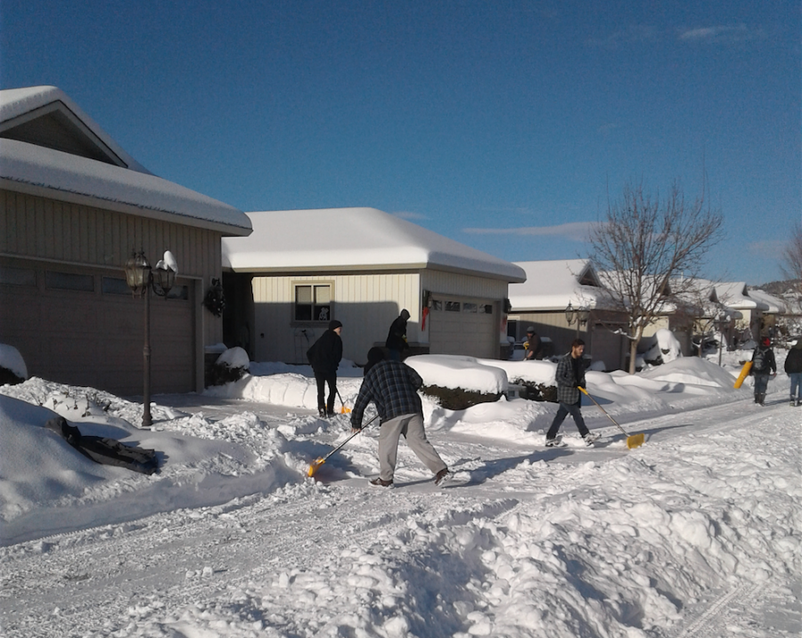 Photo credit: Liz H. - Shows an army of hired snow clearers working tirelessly to hand clear snow from 250 homes