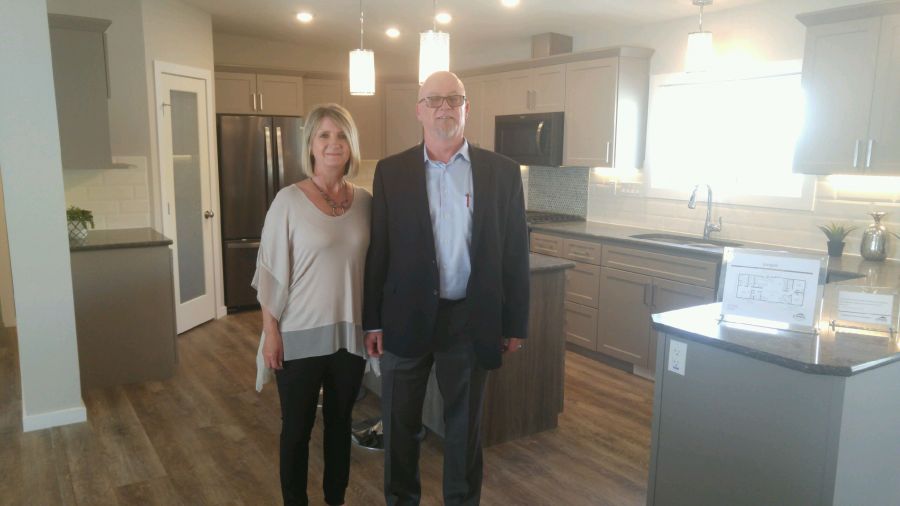 <who>Photo Credit: PentictonNow </who>Jandel Homes Ltd. president and CEO Mark Huchulak, seen with his wife Joyce, is shown at the grand opening of their retail outlet in Penticton in June. Huchulak said he's confident the business that his father started in Edmonton 40 years ago is going to enjoy the same kind of success in the B.C. market in the coming years.