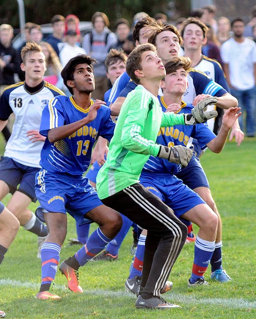 <who>Photo Credit: Lorne White/KelownaNow </who>Rutland goalkeeper, Eric Dueck, gets into position to defend against an OKM corner kick in the first half of the Okanagan Valley senior AAA soccer final at OKM.