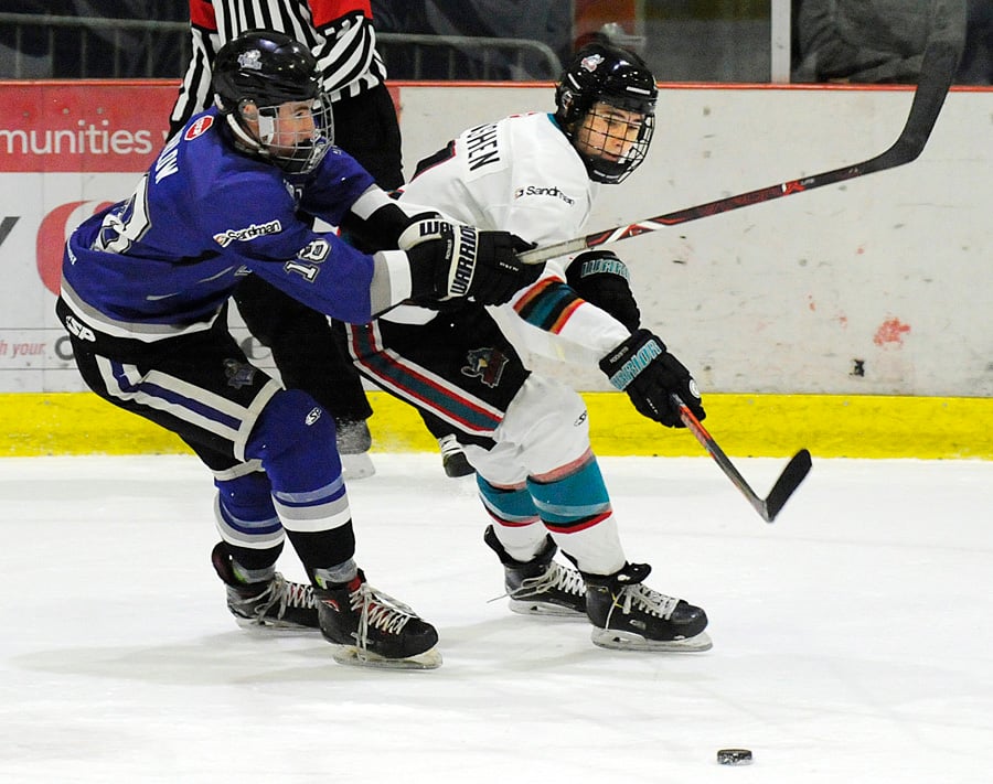 <who>Photo Credit: Lorne White/KelownaNow </who>Benn Krivoshen battles for possession with the Royals' Chase Barlow.