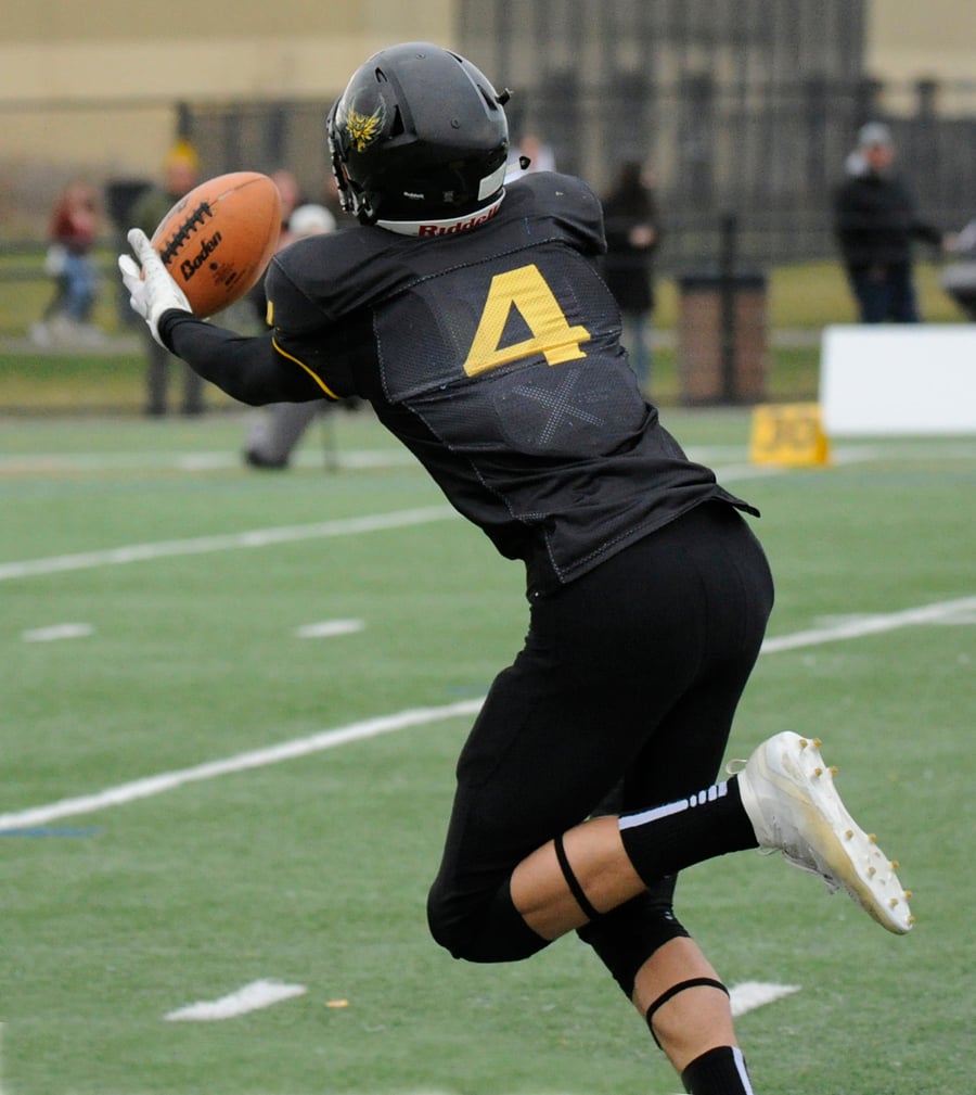 Caeleb Schlachter of the Owls catches up to a Nate Beauchemin pass. He ran the ball the rest of the way for one of his two touchdowns on the day.