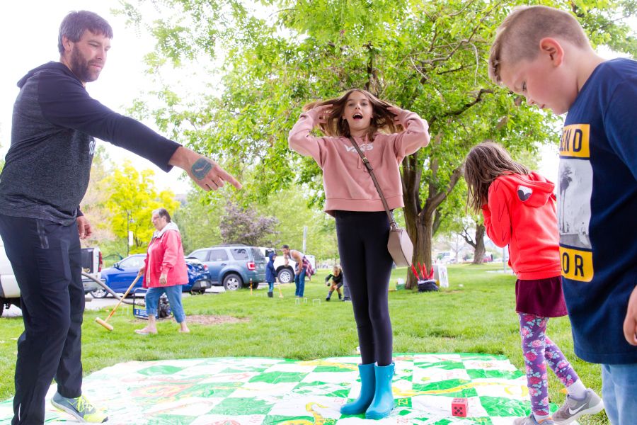 <who>Photo Credit: NowMedia</who> Dave Dorion and kids at the giant Snakes and Ladders game