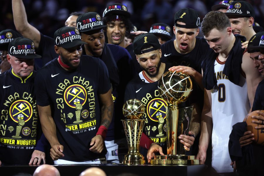 <who>Photo Credit: Getty Images</who>Jamal Murray lifts the Larry O'Brien Trophy on Monday night.
