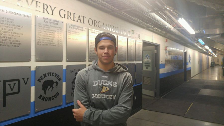 <who>Photo Credit: NowMedia </who>Jackson Niedermayer stands outside the Penticton Vees' Wall of Fame outside the current Vees dressing room. Jackson is the son of legendary NHL Hall of Fame defenceman Scott Niedermayer.