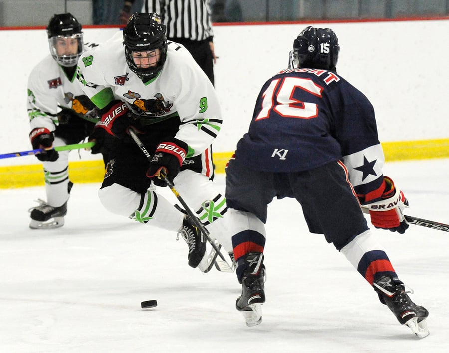 <who>Photo Credit: Lorne White/KelownaNow </who>Defenceman Jordan Lowry moves the puck out of the Chiefs' zone. He earned two assists in the 11-2 victory.