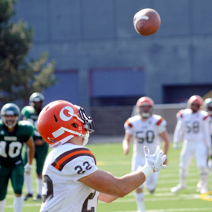 <who>Photo Credit: Lorne White/KelownaNow </who>Kyler Mosley runs under a pass from quarterback Keith Zyla in the third quarter. He caught it for a touchdown that covered 63 yards.