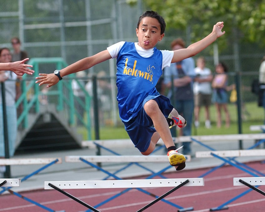 <who>Photo Credit: Lorne White/KelownaNow </who>Sorry, we can't remember this young Kelowna hurdler's name. Taken in 2005. Can anyone help?