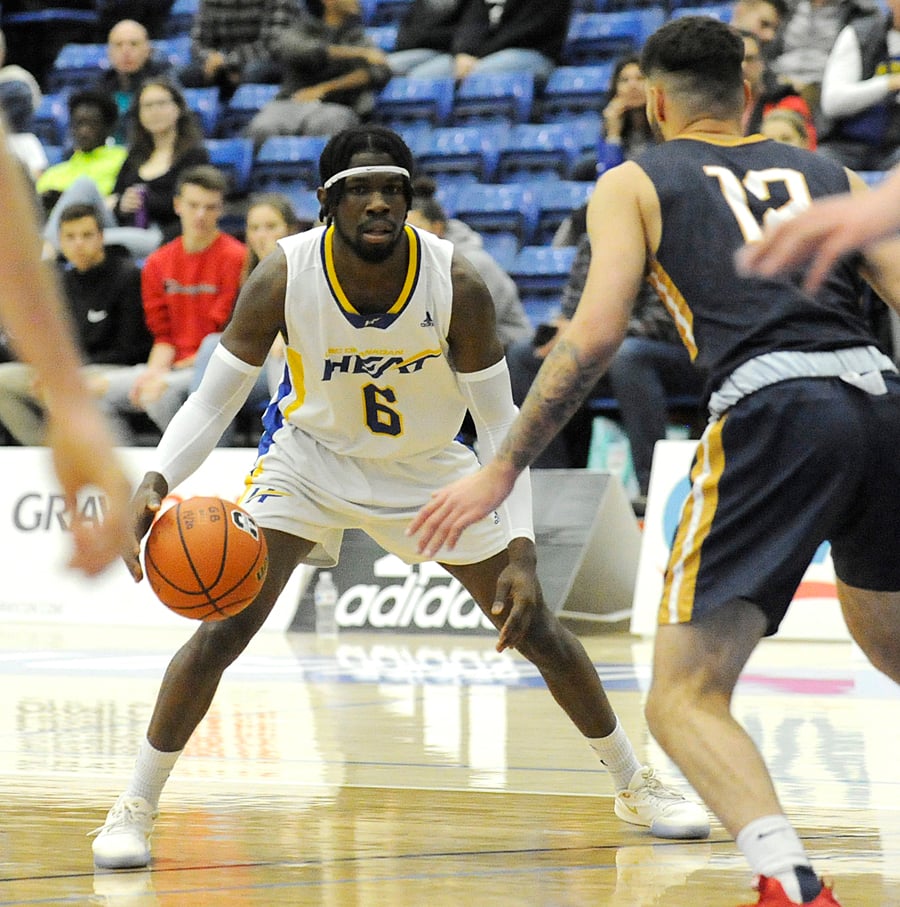 Spencer Thomas of the Heat considers his options against the UBC Thunderbirds.