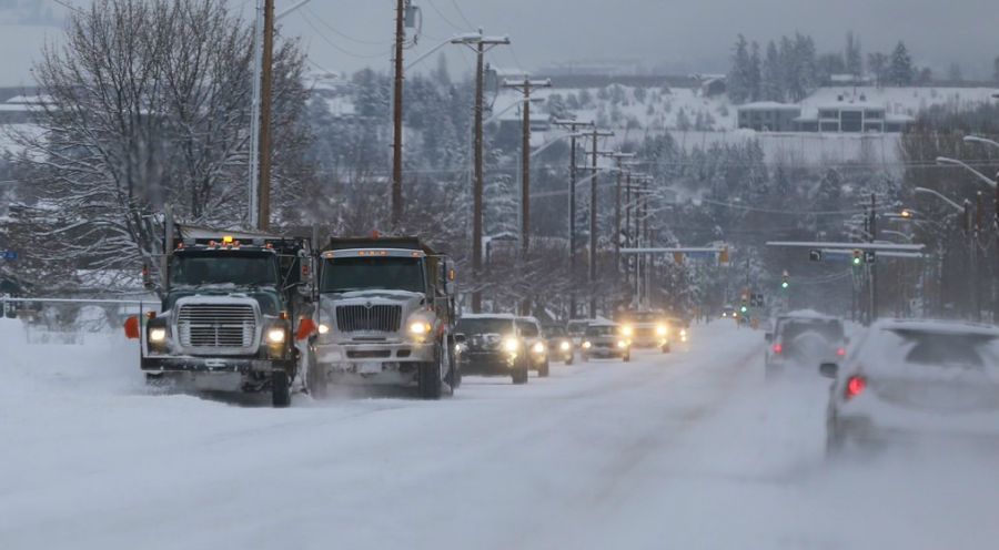 <who>Photo Credit: KelownaNow</who>City crews handle street snow removal based on priority. Make sure to give them space!