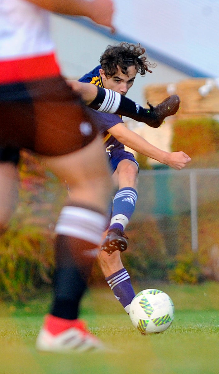 Felix Jones of the OKM Huskies unleashes a shot on the Boucherie goal in the first half.