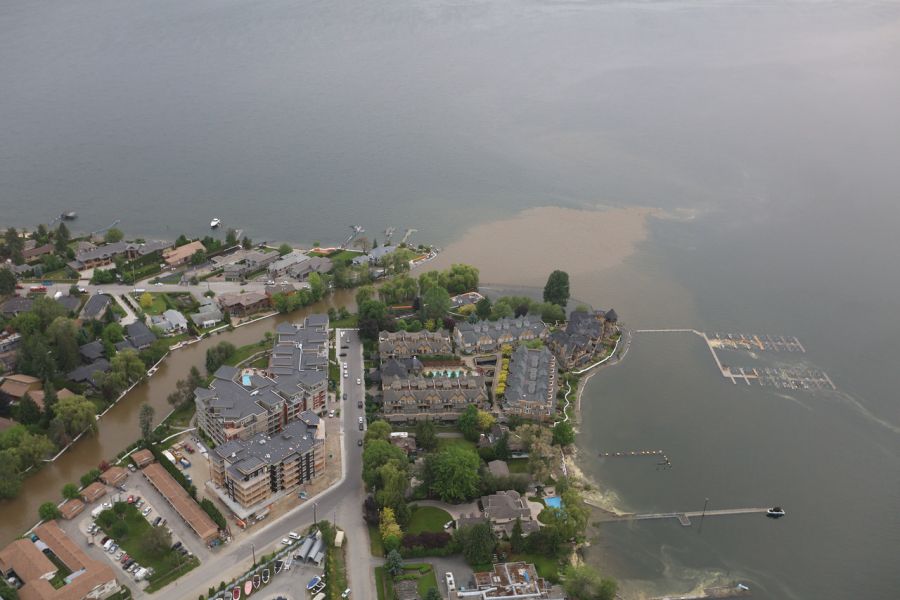 <who> Photo Credit: KelownaNow. </who> Mission Creek draining into Okanagan Lake in Lower Mission. 