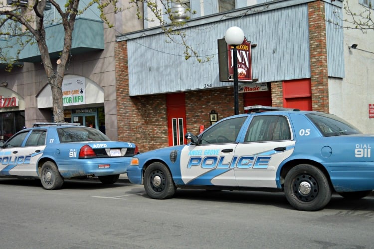 <who> Photo Credit: KamloopsBCNow </who> Angel Grove Police cruisers could be seen parked on Victoria St. on Wednesday.