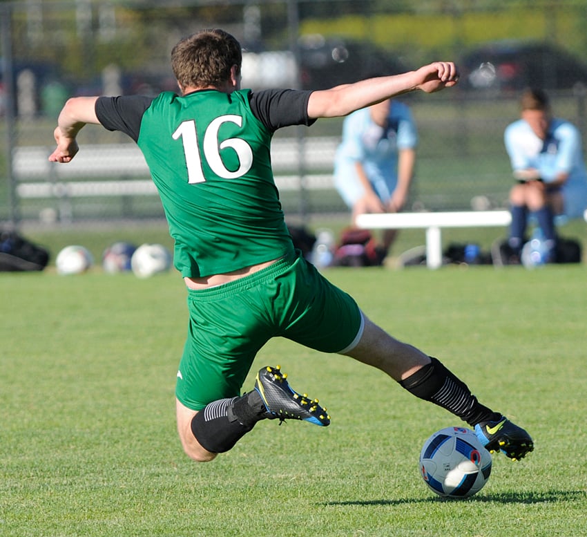 <who>Photo Credit: Lorne White/KelownaNow </who>Jasper Wyant of DekSmart Railing slides to gain control during a KMSL Div. 1 game against Okanagan FC.