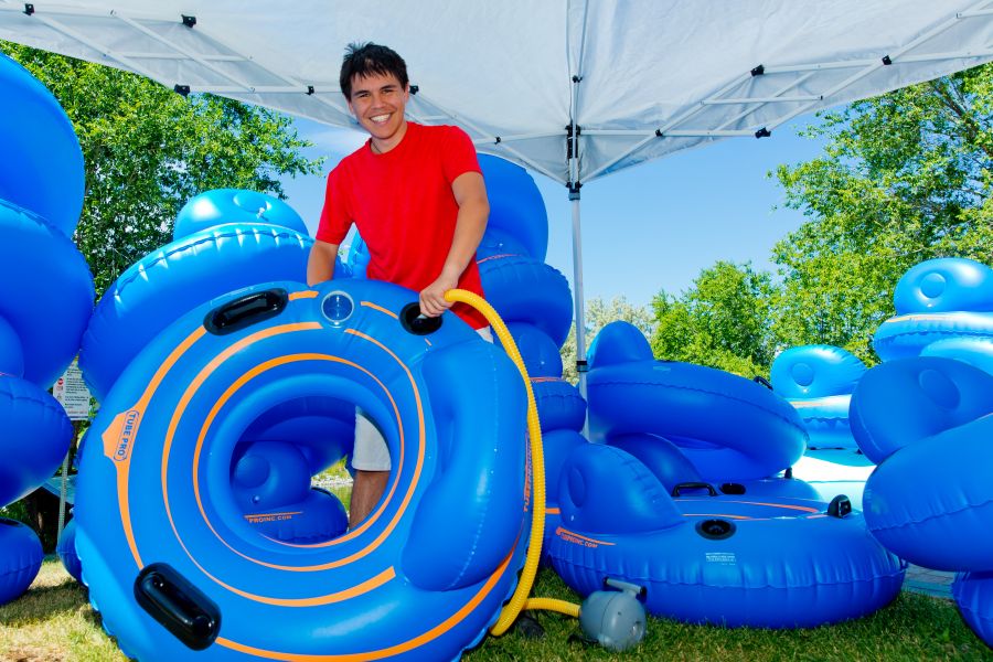 <who>Photo Credit: NowMedia</who> Coyote Cruises' Jacob George awash in a sea of floaties