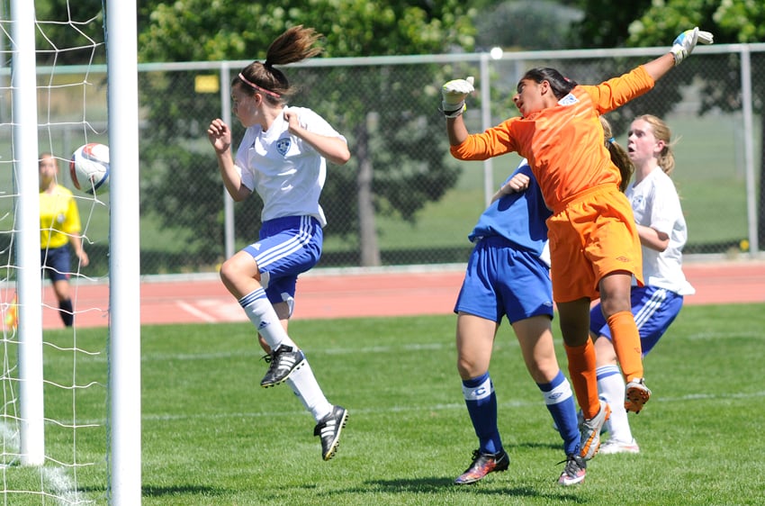 <who>Lorne White/KelownaNow </who>Chloe Alex, left, and Macalle White, right, watch as the ball heads toward the Coastal FC net for the winning goal by Abigail Taneda.