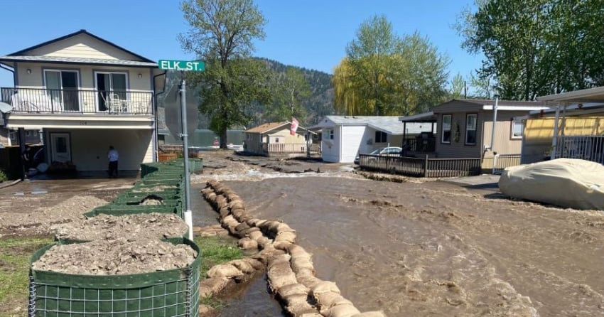 <who> Photo Credit: NowMedia </who> Severe flooding hit the neighbourhood in Parker's Cove, which is off the Okanagan Westside Road, earlier this month.