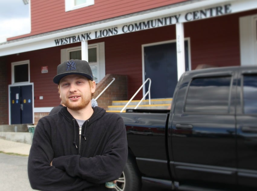 <who> Photo Credit: KelownaNow. </who> Evacuee David Lengfellner leaving the Westbank Lions Community Centre after checking in Monday morning. 