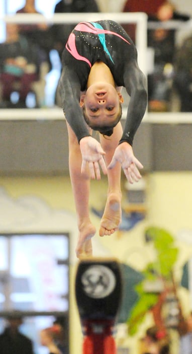 <who>Photo Credit: Lorne White/KelownaNow </who>Lucia Jakab performs on the beam in the HP Junior category.