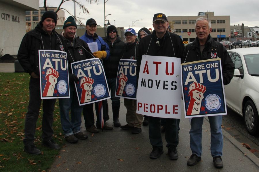 <who>Photo Credit: KelownaNow</who>Members of Local 1722 rally outside of City Hall on Tuesday afternoon, shortly before having their benefits terminated by First Canada.