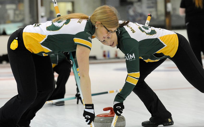 <who>Photo Credit: Lorne White/KelownaNow </who>Taylor Theroux, left, and Taylor McDonald of the University of Alberta Pandas sweep Kelsey Rocque rock.