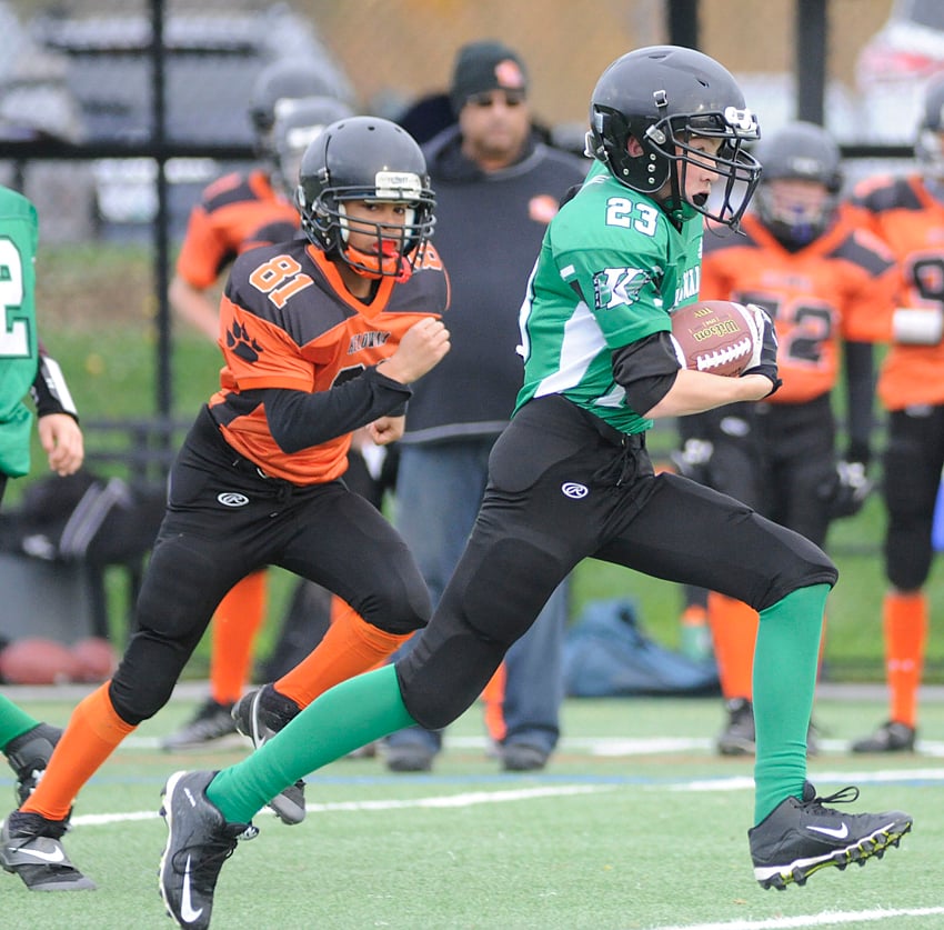<who>Photo Credit: Lorne White/KelownaNow </who>Dawsen Powley of the Kelowna Riders is in full stride en route to a large gain against the Lions.