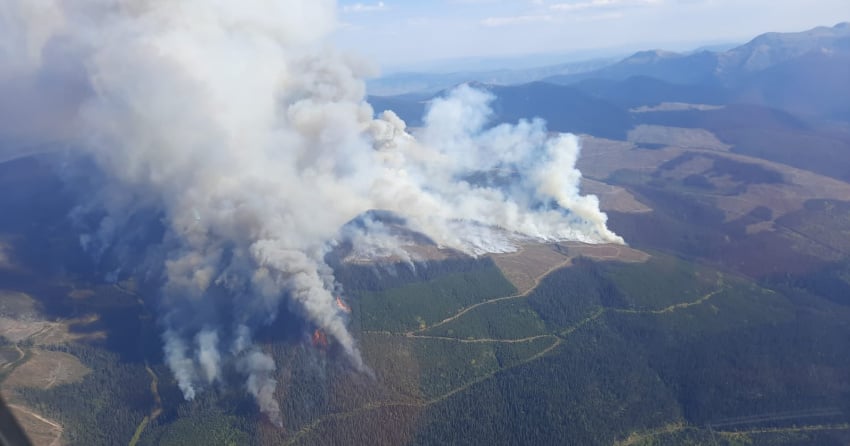 <who> Photo Credit: BCWS </who> The Battleship Mountain wildfire has now surpassed 30,000 hectares, however, rain is expected to help reduce fire activity.