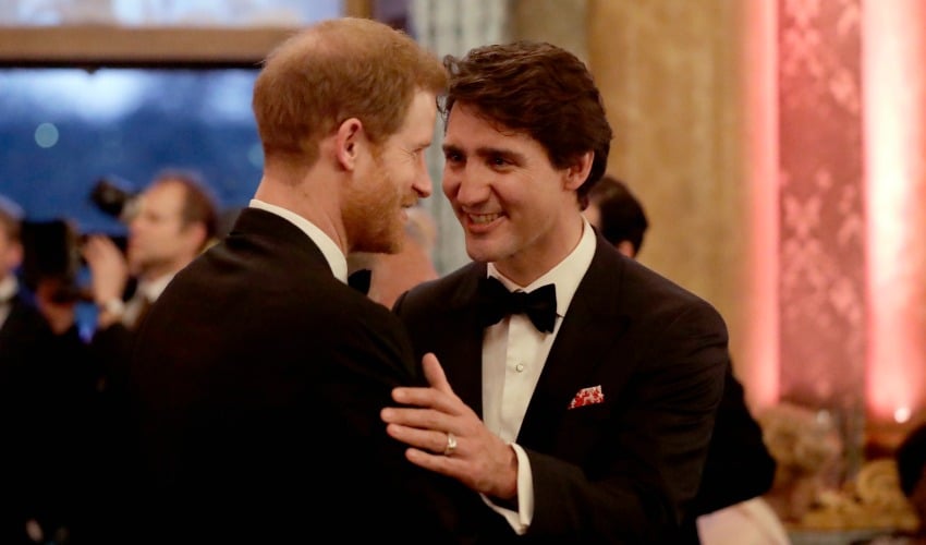 <who> Photo Credit: Getty Images </who> Prince Harry chats with Justin Trudeau during a reception for the Queen's Dinner for the Commonwealth Heads of Government Meeting at Buckingham Palace on Apr. 19, 2018.