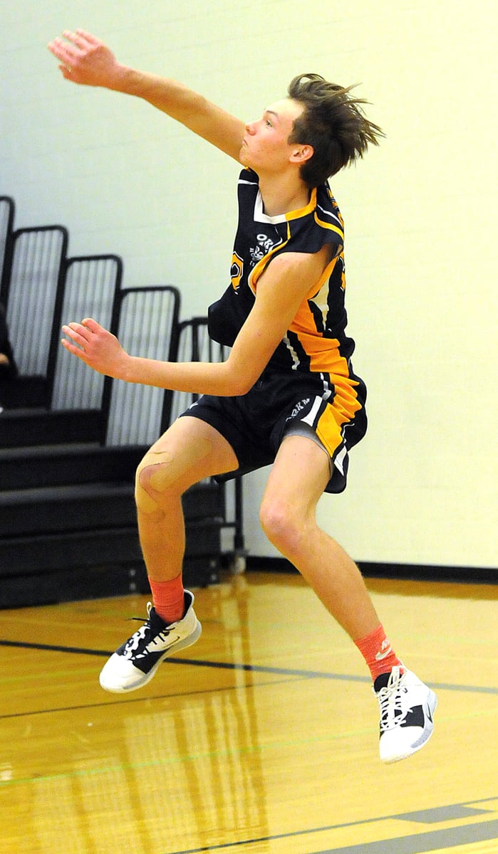Aaron Saufferer serves for the Huskies.