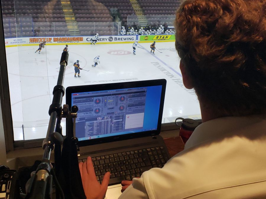 <who> NowMedia </who> Vees announcer Joey Pitt at the crowd noise controls.