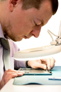 a man who is working on an iPad.